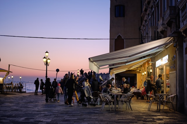 Sicilian piazza café couple sunlight 