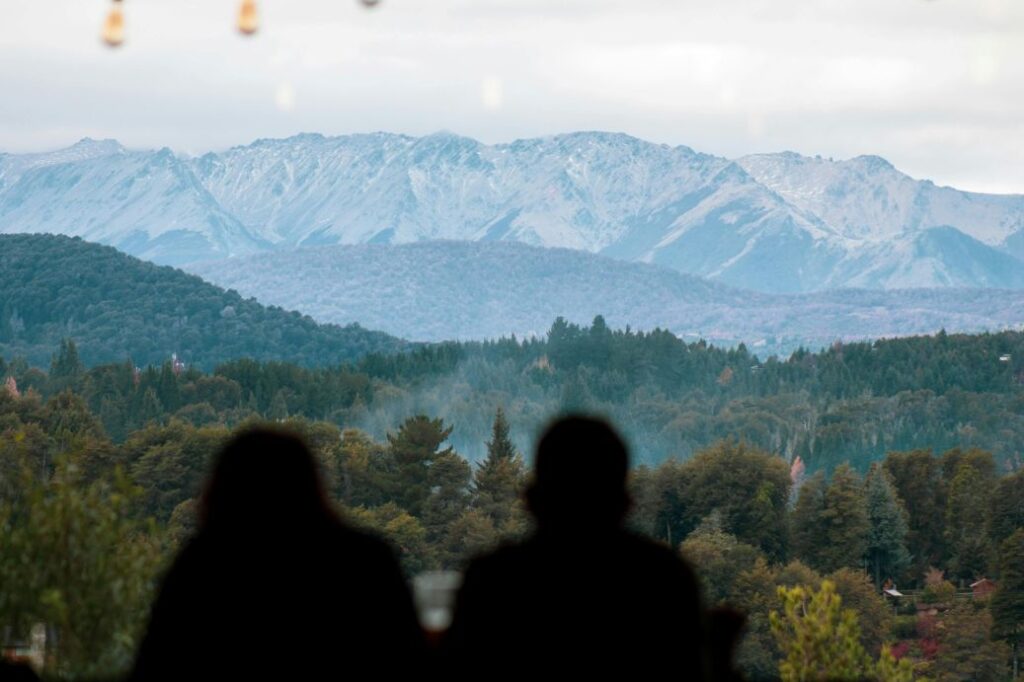 Couple relaxing at a luxury Patagonia lodge with mountain views