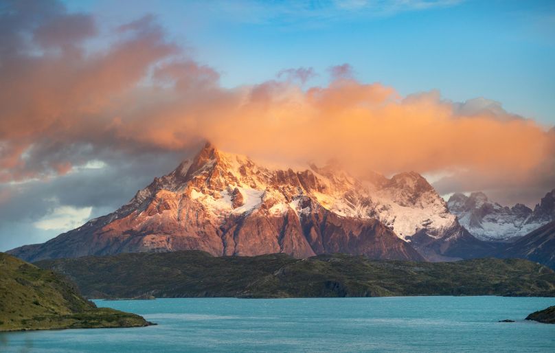 sunny Torres del Paine landscape with lake and mountain peaks