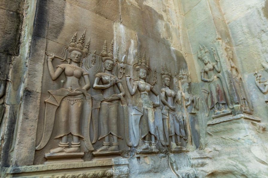 Detailed bas-relief carvings inside Angkor Wat temple galleries