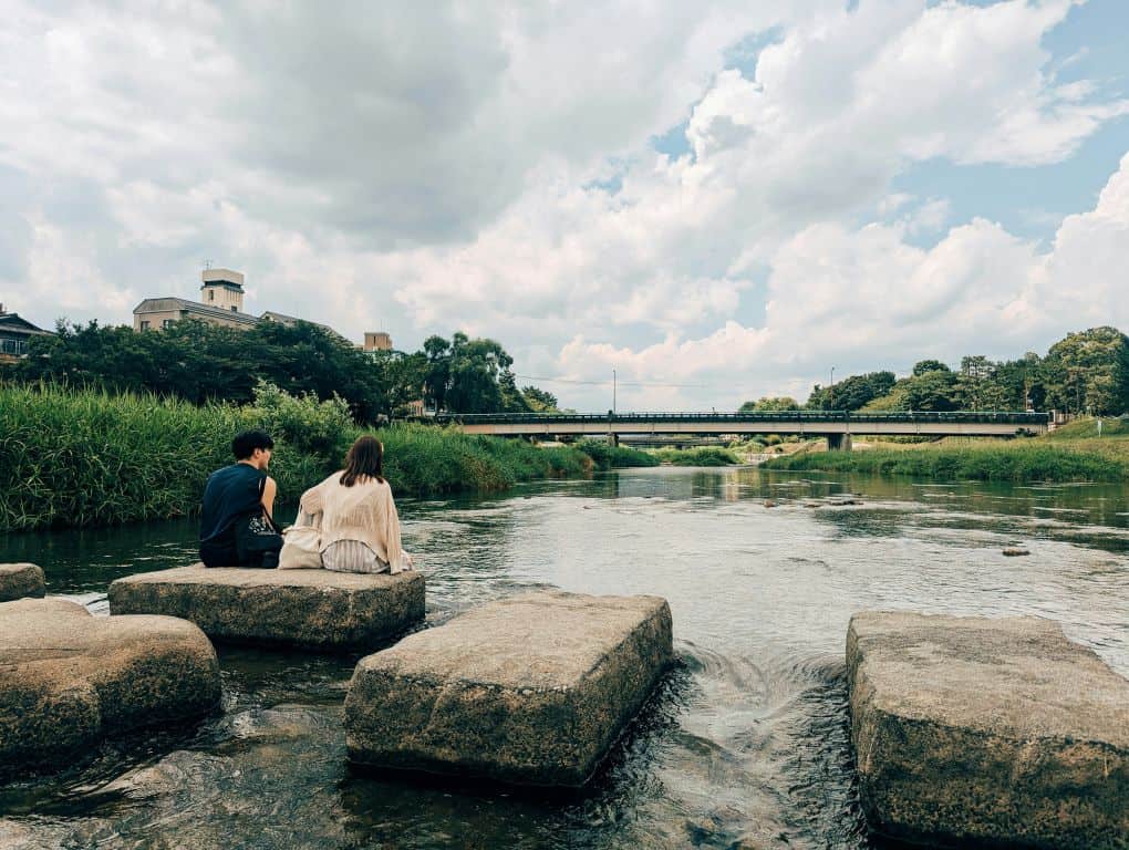 Couple crossing a bridge in Uji during a Kyoto day trip