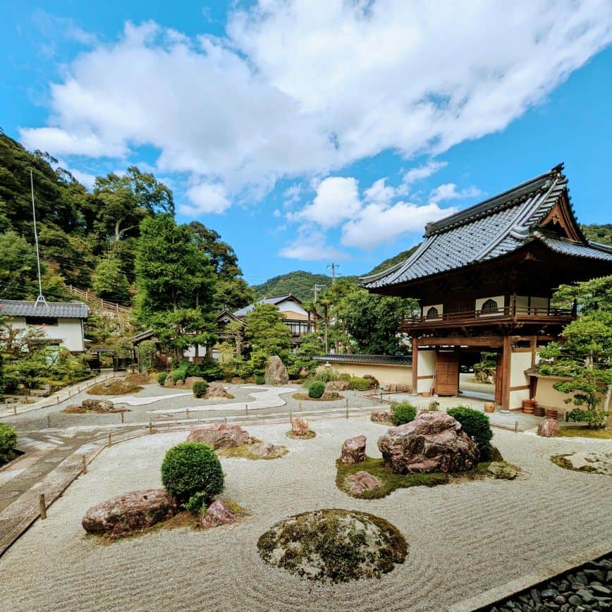 Autumn garden at a Kyoto ryokan with colorful maple leaves