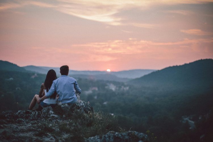 A couple enjoying one final panoramic view of Budapest illuminated at night