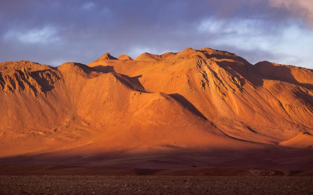 Couple watching sunset in the Atacama Desert