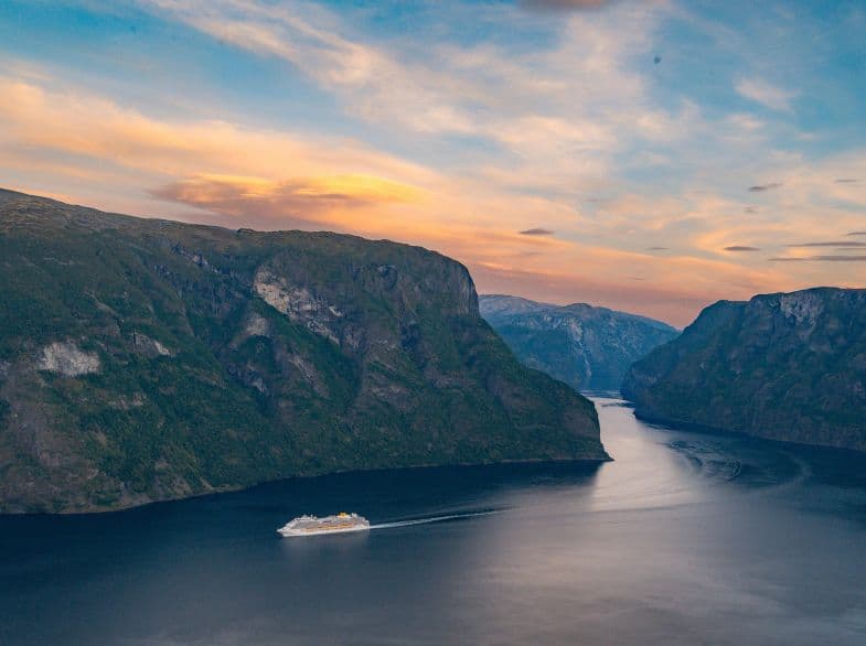 norwegian fjords couple sunset cruise