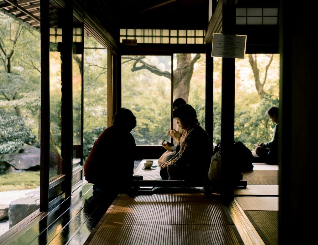 Couple enjoying a Kyoto tea house garden during a cultural trip