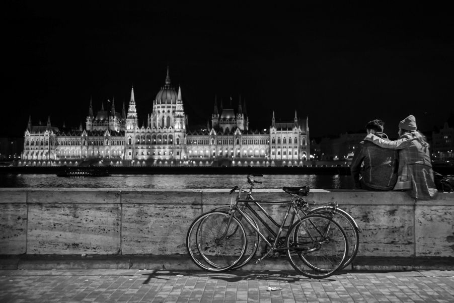 A couple enjoying a relaxed evening in a quiet Budapest neighborhood