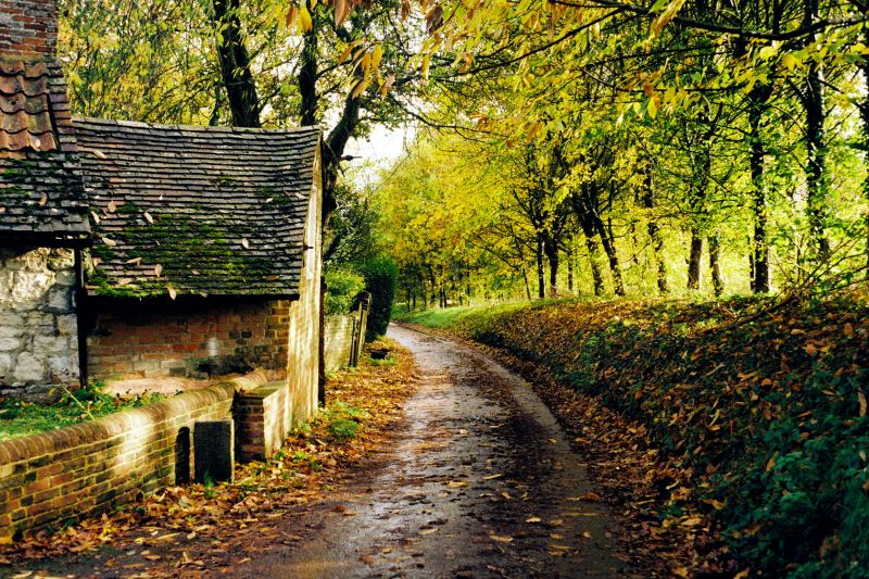 Scenic English countryside road through rolling hills