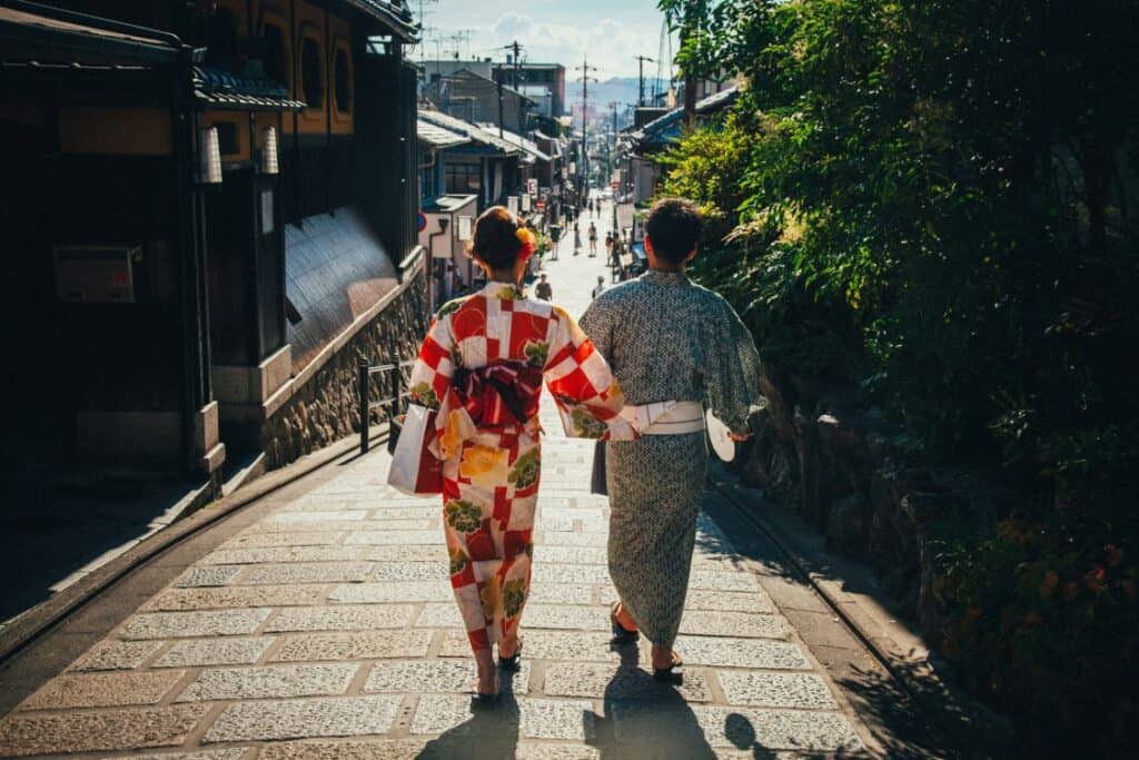 Couple walking through peaceful Kyoto temple grounds