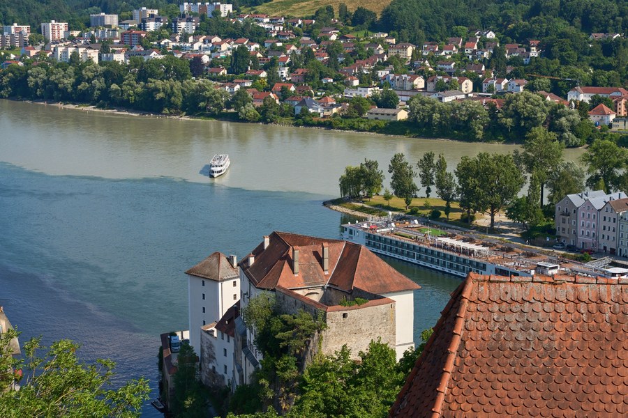 [Scenic Wachau Valley along the Danube River showing vineyards and historic towns]