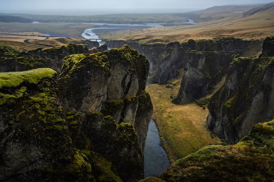 Cozy Iceland countryside hotel surrounded by mountains and open natural scenery.