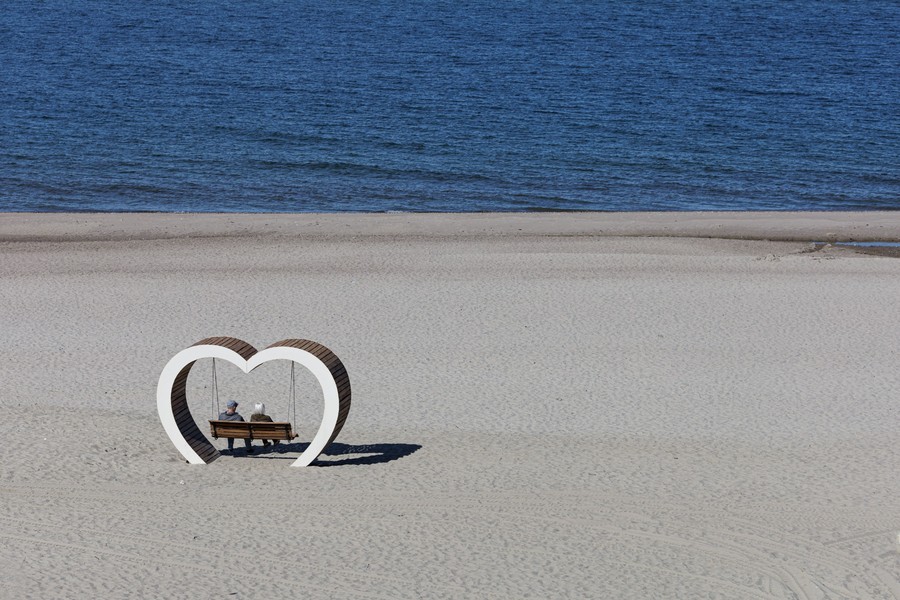 • A couple reviews a simple travel itinerary before their next empty nest trip.